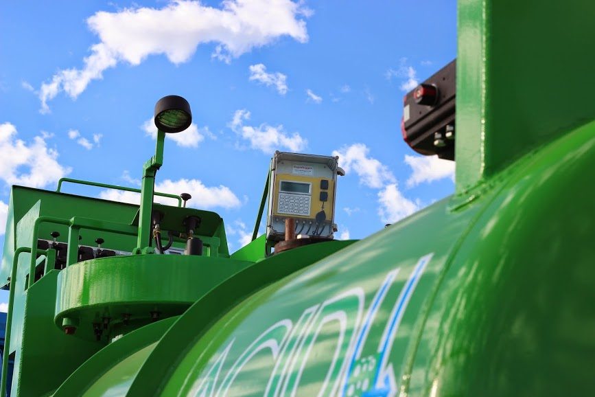 Rapidlogger recorder mounted on the frame of a green Acidizing Technology acid pumping truck