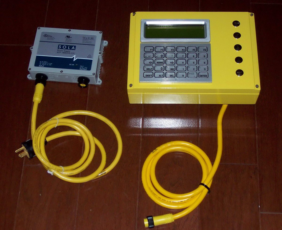 Rapidlogger System serial number 1, a yellow keypad unit with its power supply and cables